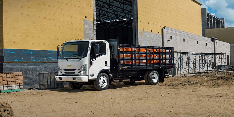 2024 Chevrolet Low Cab Forward Truck at a construction site