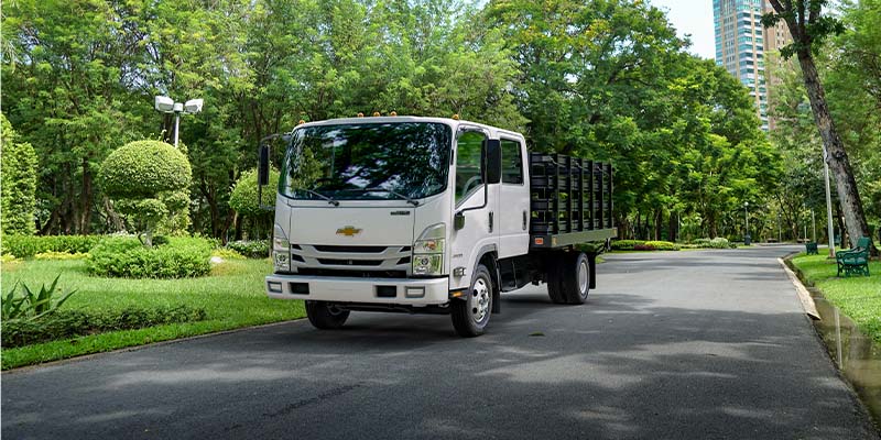 2024 Chevrolet Low Cab Forward Truck driving in a neighborhood